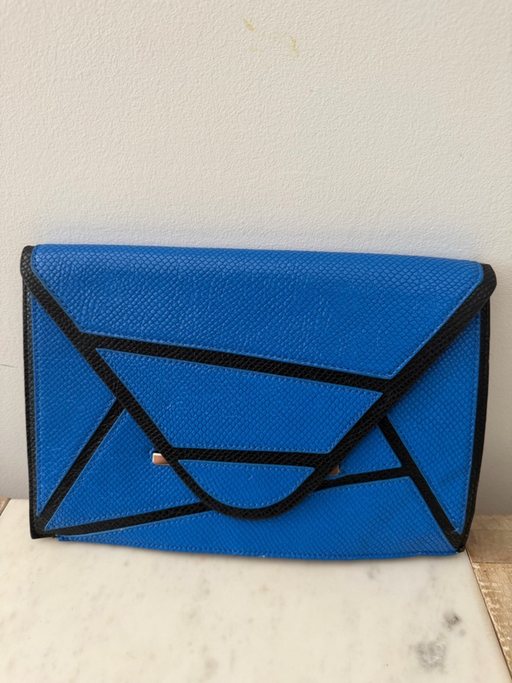 BCBGMaxAzria Blue Envelope Clutch with Black Trim and Gold Logo